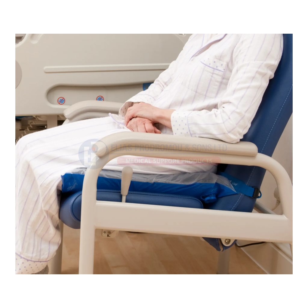 Uncovered Repose Cushion supporting a seated patient in a clinical chair. Cushion inner shown; selected set also includes an EU blue PU cover and Small Pump. Chair is not included.